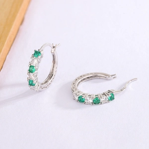 Silver hoop earrings with alternating green and white cubic zirconia set in S925 sterling silver