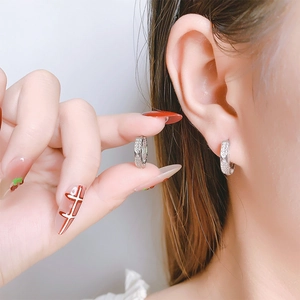 Roman numeral hoop earrings with silver diamond inlay and luxury quilted pattern design