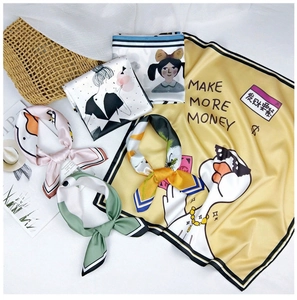 Detailed view of printed silk scarves featuring retro patterns and lifestyle props
