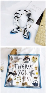 Detail of square silk scarf with floral illustrations and Thank You text prints