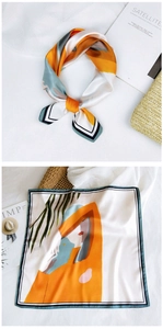 Detail of silk square scarf featuring artistic female silhouette and palm leaf prints