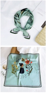 Detail of silk-feel square scarf featuring artistic illustrations and striped edges