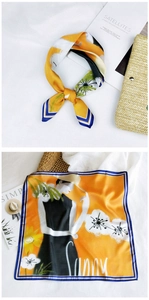 Artistic silk square scarf with yellow floral print and blue striped borders on white fabric