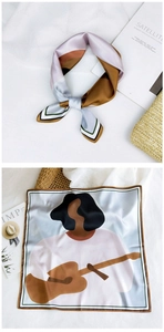 Artistic square silk scarf detail featuring abstract guitar print and striped borders