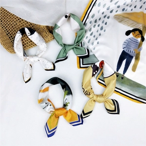 Colorful silk square scarf collection with floral patterns and polka dots on white background