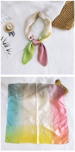 Detail of multi-color gradient silk square scarf with soft pastel tones and silky texture