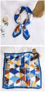 Detailed view of square silk scarf with geometric prints and satin finish for women