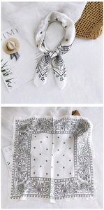 Detail of silk square scarf featuring vintage celestial print with moon and stars