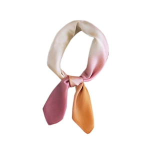 Gradient square silk scarf in pink and orange tones styled as a decorative necktie