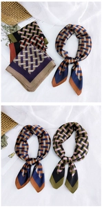 Flat lay showing geometric silk scarves in various color options with elegant decor