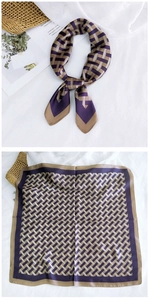 Detail of silk square scarf featuring purple geometric patterns and golden borders
