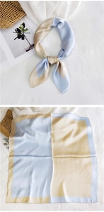 Detail of color-block satin square scarf in light blue and beige with silk texture
