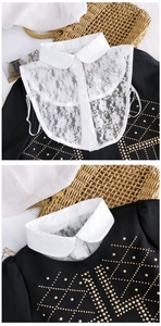 Détail d'un faux col en dentelle blanche fleurie avec fermeture délicate par bouton