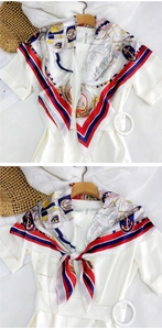 Detail of nautical silk scarf with anchor prints and red-blue stripes on white dress