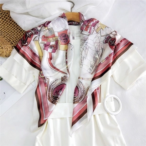 Elegant nautical print silk scarf featuring sailboats and anchors on a summer dress