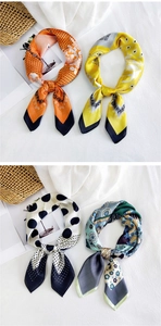 Detail of colorful satin square scarves with patterns like dots and floral prints