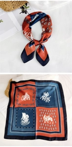 Exotic print silk scarf detail with elephant and sailing boat patterns in retro colors