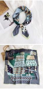 Detail of vintage geometric silk scarf with fine stitched edges and patchwork patterns