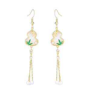 Bamboo leaf and gourd drop earrings with gold tassels and pearls on white background