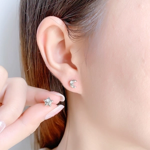 Asymmetric silver star and crescent moon stud earrings with iridescent pearl inlays