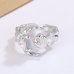 Detailed close-up of a silver moon-shaped ring with liquid metal texture and adjustable band