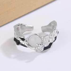 Irregular silver open ring with molten metal texture and opal-like white gemstone