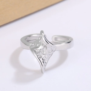 Irregular lava-textured adjustable silver ring with minimalist aesthetic and molten design