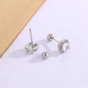 Detail of square zircon halo earrings with secure screw back ball closures for women