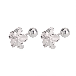 Detail of silver S925 flower studs showing matte texture and secure screw ball backs