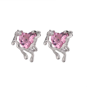 Close-up of heart-shaped pink diamond earrings with liquid metal lava texture