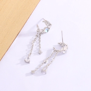 Detail of silver moon tassel earrings with waterdrop zircon and iridescent moonstone