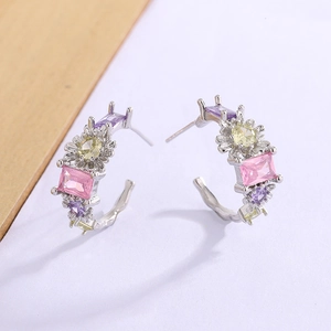 Elegant C-shaped silver earrings with colorful zircon stones in pink and purple tones