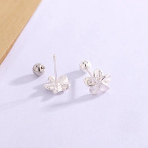 Minimalist silver flower stud earrings with zircon center and secure screw back