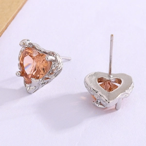 Elegant irregular silver heart stud earrings with sparkling champagne heart-shaped gemstones