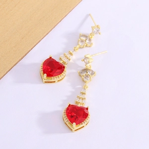 Elegant gold earrings featuring red heart-shaped zircon stones and sparkling crystals