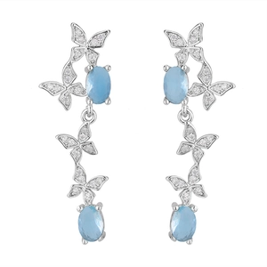 Detail of linear butterfly drop earrings with light blue crystals and silver finish