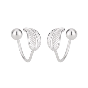 Detail of silver leaf ear cuff with polished metal bead and textured vein patterns