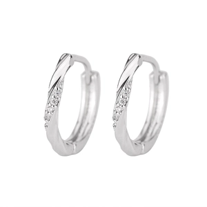 Detailed view of silver twisted hoop earrings with sparkling cubic zirconia pavé