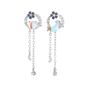 Asymmetric floral earrings with blue moon and star tassels in S925 silver finish