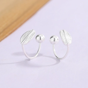 Silver leaf feather ear cuff with polished metal bead and delicate vein texture details