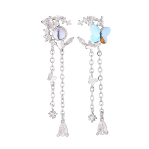 Asymmetric silver moon and blue butterfly drop earrings with zircon fringe details