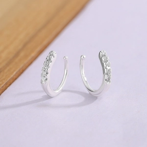 Elegant silver ear cuff with sparkling pavé stones in a minimalist U-shaped design