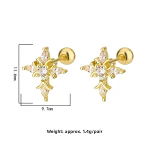 Detail view of gold cross stud earrings with marquise cubic zirconia and screw ball backs