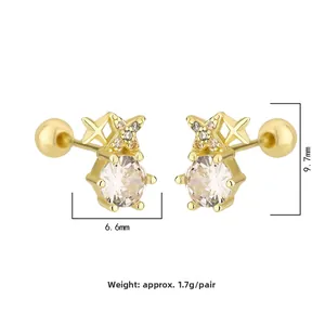 Detailed view of gold mini zircon stud earrings with 6.6mm by 9.7mm size measurements