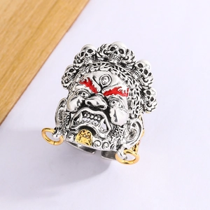 Macro detail of retro ring featuring Mahakala skull crown and red eye paint accents