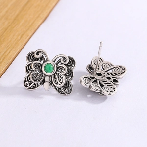 Vintage silver butterfly earrings with green agate and intricate filigree design