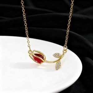 Elegant gold tulip necklace with red crystal bud and zircon leaves on black silk