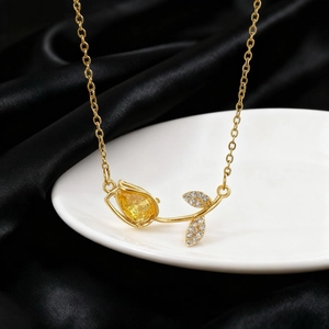 Elegant gold tulip necklace with yellow teardrop gemstone and sparkling zircon leaves