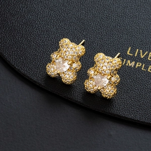 Chic gold teddy bear stud earrings with sparkling pavé crystals and heart-shaped stone