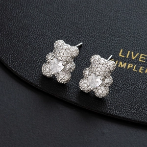 Charming bear stud earrings with pave crystals and heart-shaped center stone in silver